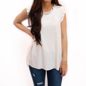 IVORY SLEEVELESS MOCK-NECK TANK WITH RUFFLE DETAIL